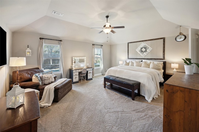 carpeted bedroom with lofted ceiling and ceiling fan