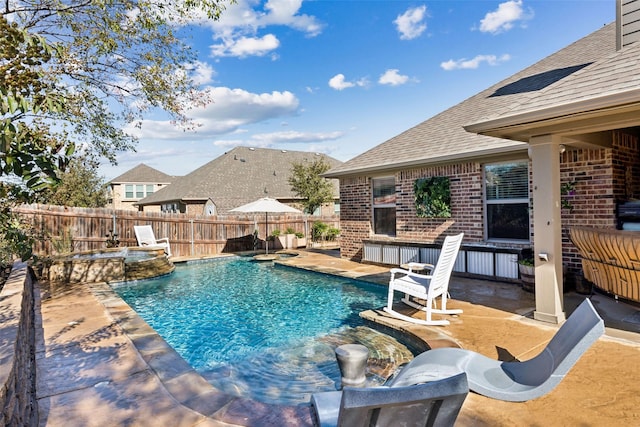 view of pool with a patio and pool water feature