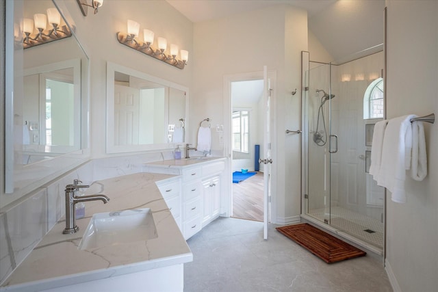 bathroom featuring an enclosed shower, tile patterned floors, and vanity