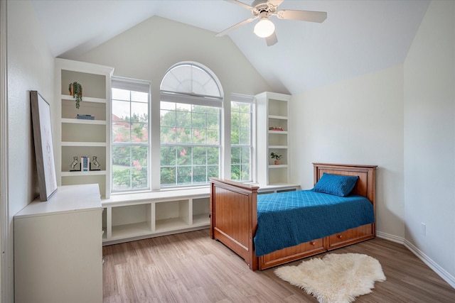 bedroom with lofted ceiling, ceiling fan, and hardwood / wood-style flooring