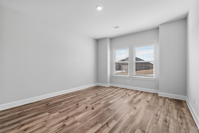 unfurnished room with light hardwood / wood-style flooring