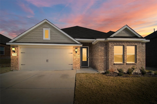 craftsman house with a yard and a garage