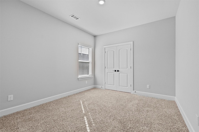 unfurnished room with carpet flooring