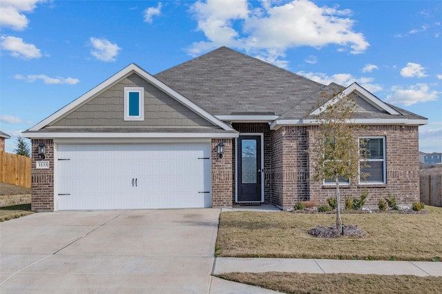 view of front facade featuring a garage and a front lawn