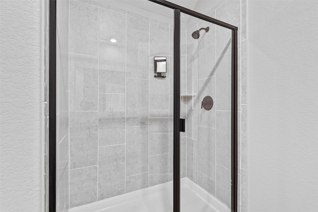 bathroom featuring an enclosed shower