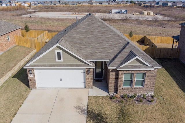 view of front of house with a front lawn and a garage