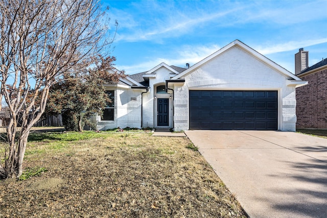 view of front of property with a front lawn and a garage