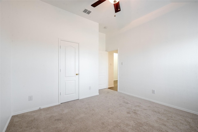 unfurnished bedroom featuring light carpet and ceiling fan