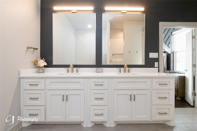 bathroom with vanity and tile patterned flooring