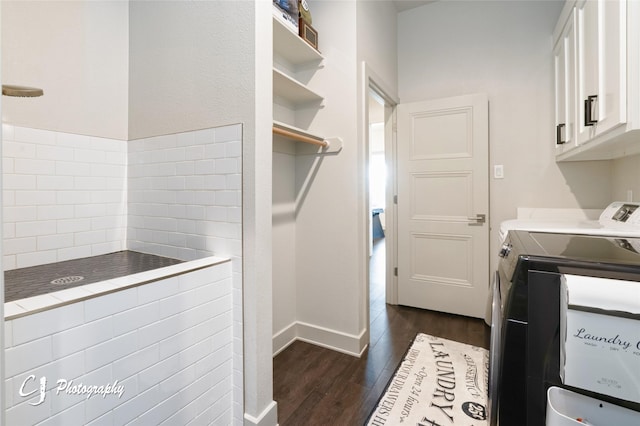 laundry area featuring dark hardwood / wood-style flooring, cabinets, and independent washer and dryer