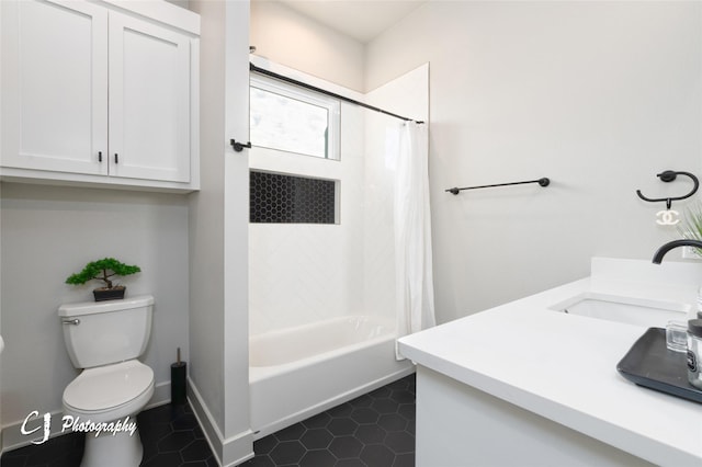 full bathroom with vanity, shower / bath combination with curtain, tile patterned floors, and toilet