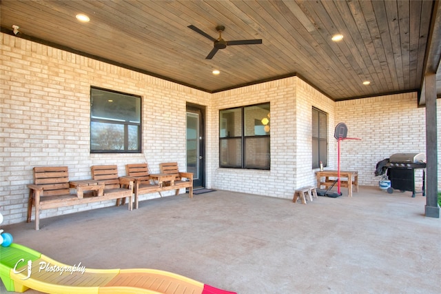 view of patio with an outdoor living space, ceiling fan, and area for grilling