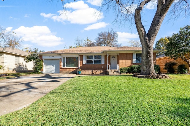 ranch-style home featuring a garage and a front yard