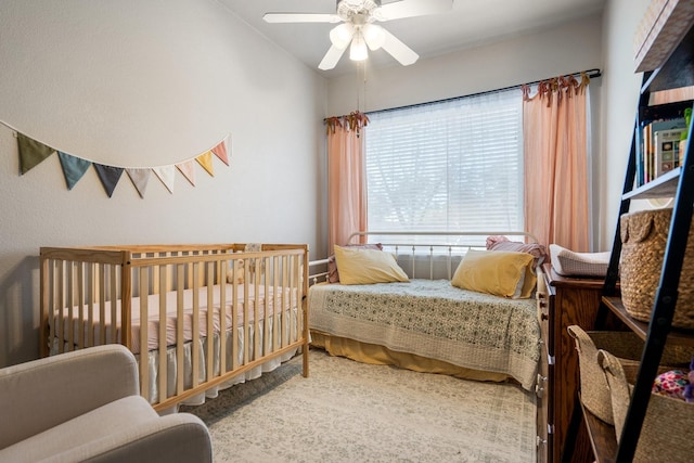 carpeted bedroom with ceiling fan