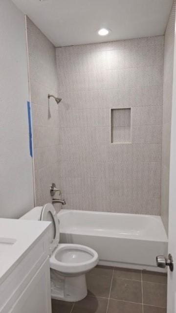 full bathroom featuring shower / bathtub combination, tile patterned flooring, vanity, and toilet