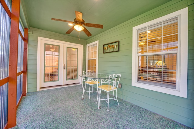 sunroom / solarium with french doors and ceiling fan