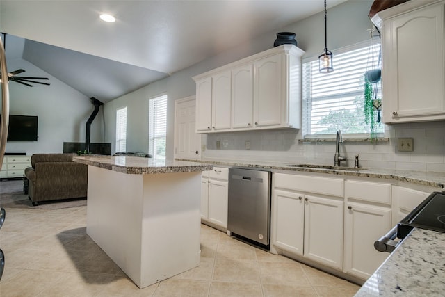 kitchen with white cabinets, appliances with stainless steel finishes, vaulted ceiling, and pendant lighting