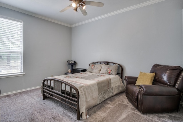 carpeted bedroom with ceiling fan and crown molding