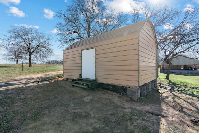 view of outbuilding featuring a rural view