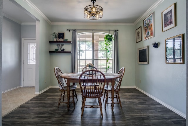 dining space featuring a notable chandelier, dark hardwood / wood-style flooring, and crown molding