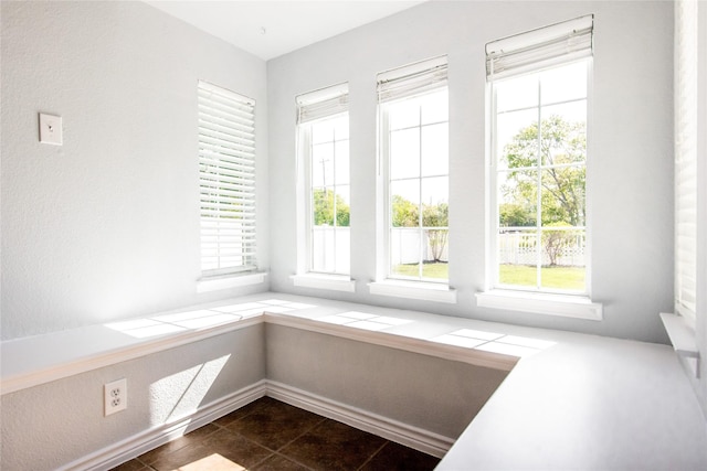 interior space with dark tile patterned flooring