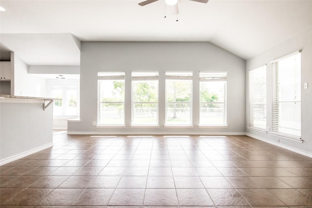 unfurnished living room with lofted ceiling, ceiling fan, and tile patterned floors