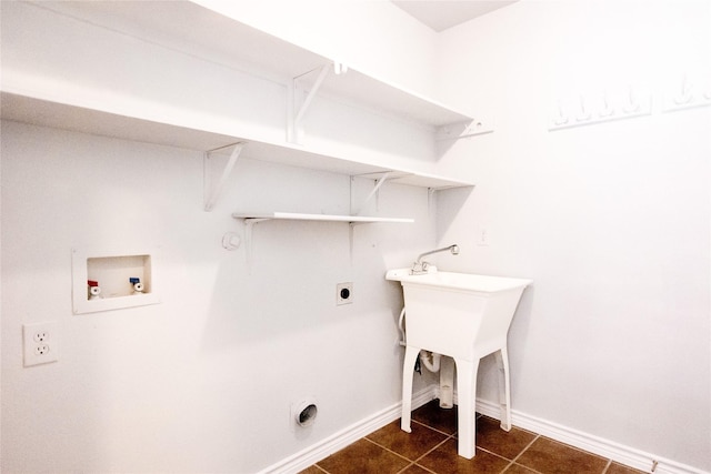 laundry room featuring electric dryer hookup, dark tile patterned flooring, gas dryer hookup, and washer hookup