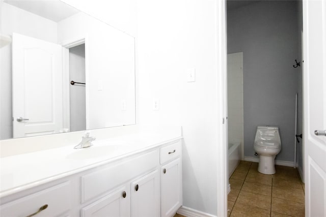 bathroom with vanity, tile patterned floors, and toilet