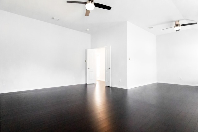 unfurnished room featuring ceiling fan and dark hardwood / wood-style flooring