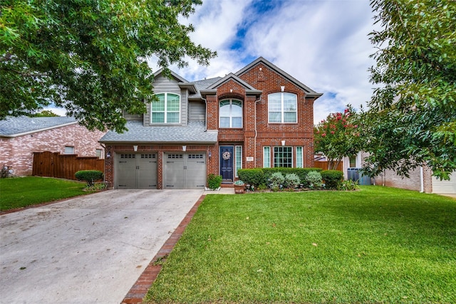 view of front of house featuring a garage and a front lawn