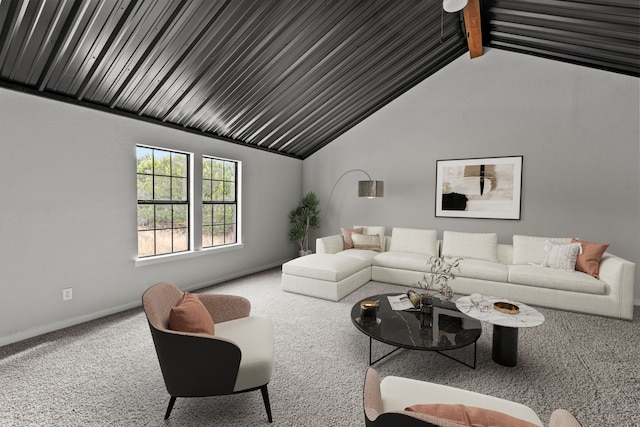 carpeted living room featuring vaulted ceiling with beams and baseboards