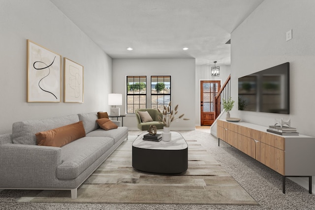 living room with light carpet, baseboards, stairway, an inviting chandelier, and recessed lighting