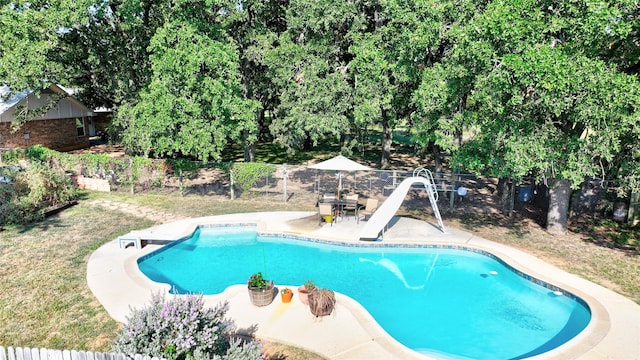 view of swimming pool featuring a water slide