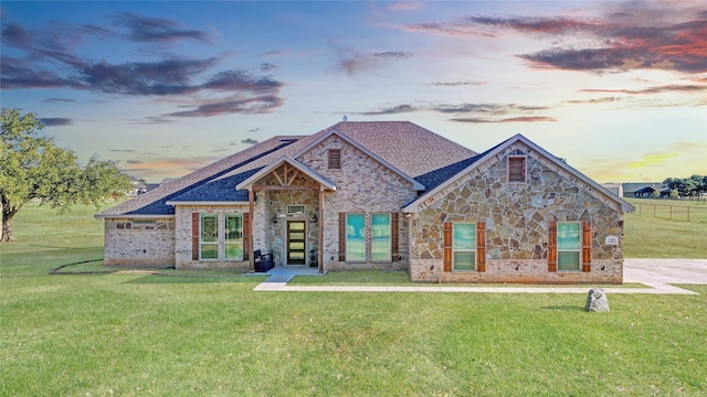 craftsman-style home featuring a lawn