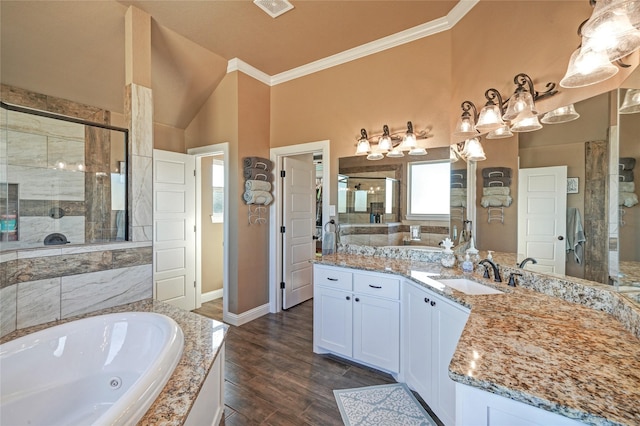 bathroom featuring lofted ceiling, hardwood / wood-style flooring, independent shower and bath, vanity, and crown molding