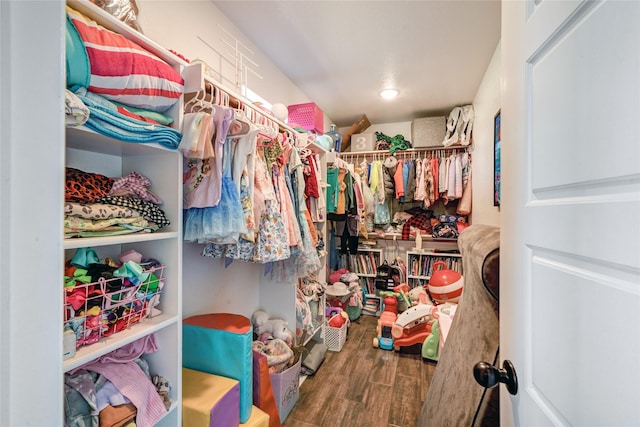 walk in closet featuring hardwood / wood-style floors