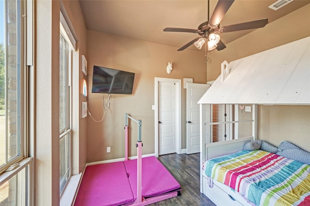 bedroom with ceiling fan and dark hardwood / wood-style flooring