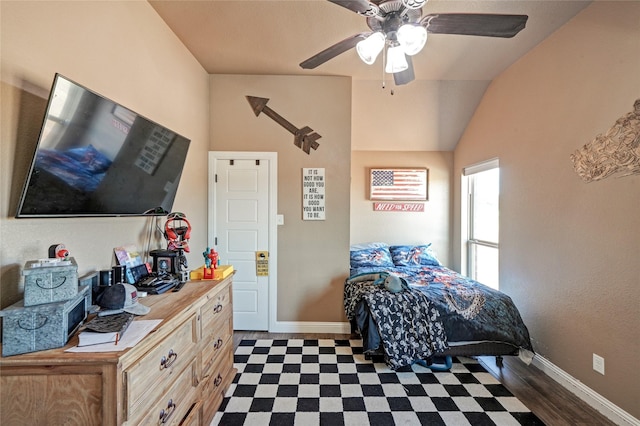 bedroom featuring ceiling fan, lofted ceiling, and dark hardwood / wood-style floors