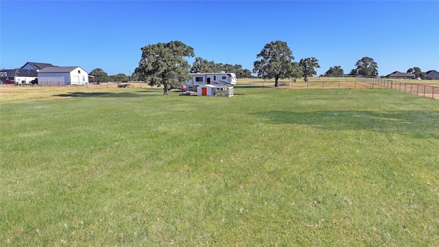 view of yard with a rural view