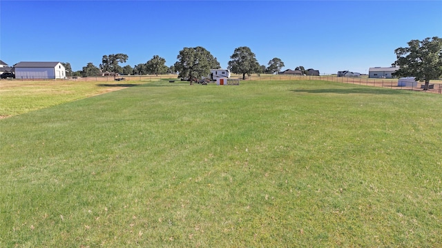 view of yard with a rural view