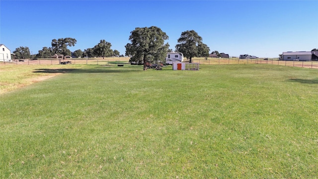 view of yard with a rural view