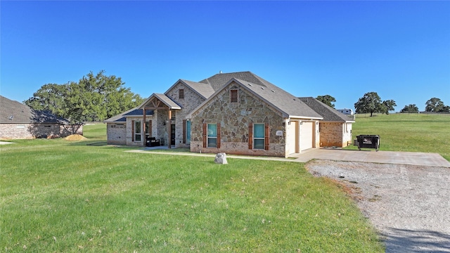 craftsman house with a front lawn and a garage