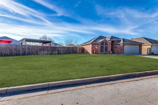 view of front of house with a front lawn and a garage