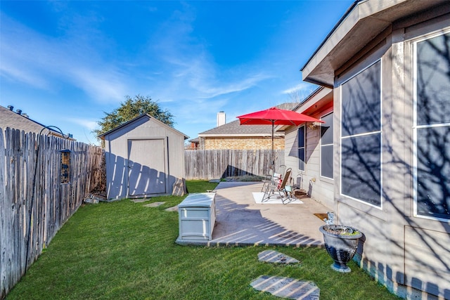 view of yard with a shed and a patio