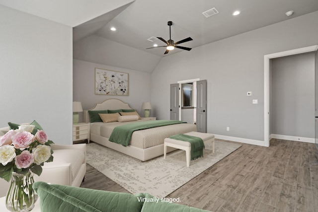 bedroom with vaulted ceiling, wood-type flooring, and ceiling fan