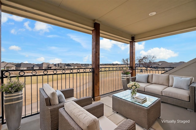 view of patio with a balcony and outdoor lounge area