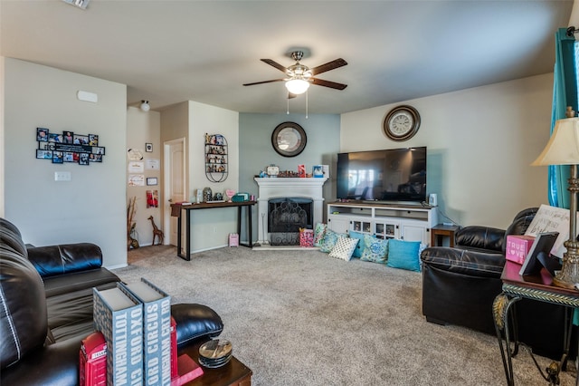 carpeted living room with ceiling fan