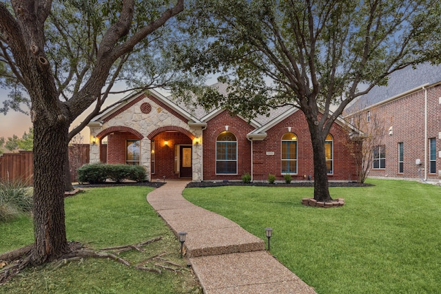 ranch-style house featuring a yard