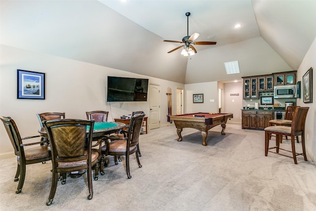 recreation room featuring pool table, indoor bar, ceiling fan, and light carpet