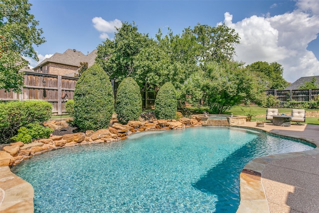 view of pool featuring a patio